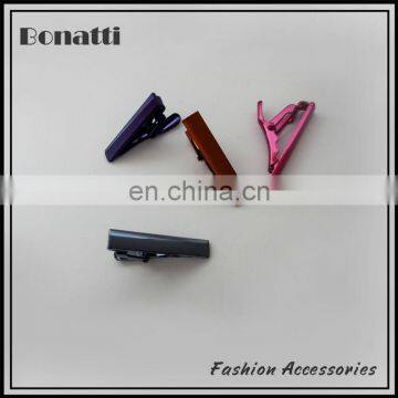 small colorful tie clasps