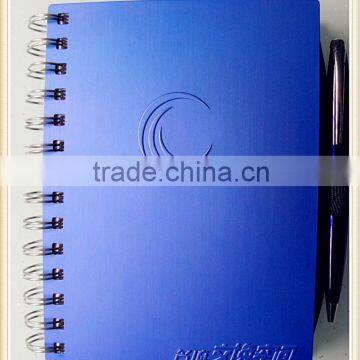 spiral bound notebook with ball pen