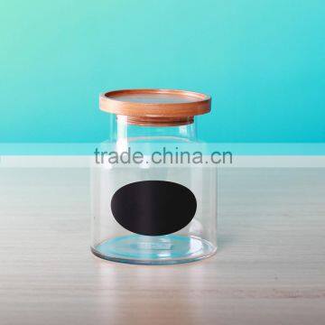 glass small jars with wood cover and black sticker