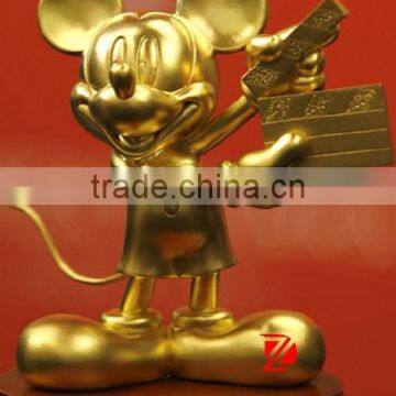 Metal gold mickey mouse sculpture as Action director statue