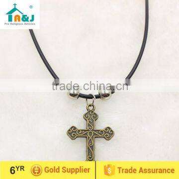 Antique brass cross cord pendant