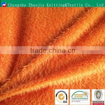 Orange long pile plush fabric for making soft toys fishbone fabric for toy ,garment ZJ089