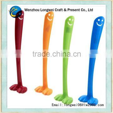 funny smiling long plastic shoe horn