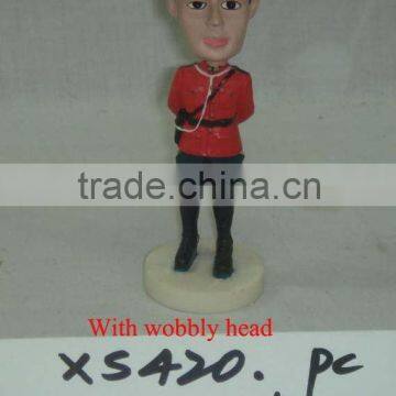 Polyresin Canadian Policeman with wobbly head.