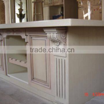 wood kitchen island cabinets with black marble benchtop