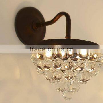 0108-13 CRYSTAL Clear glass droplets sparkle in the light cast by this bronze-finished sconce