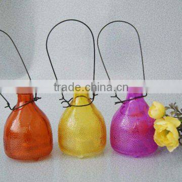 middle size colored glass wasp bottle