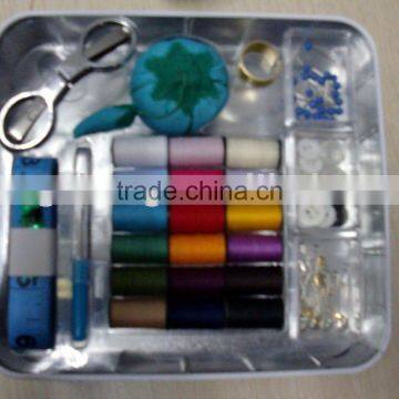 retro sewing kit in tin