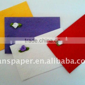 handmade paper envelope with artificial flower