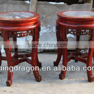 wooden stool with stone surface