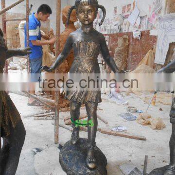 Bronze sculpture of little kid