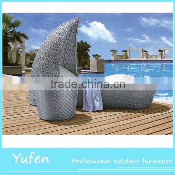 Shell shaped rattan poolside outdoor sunbed