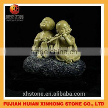 Double lovely little monk stone statue played the flute