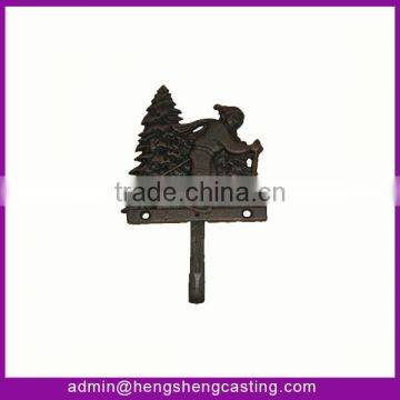cast iron pine tree and snowman decorative hook