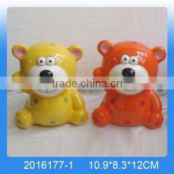 Lovely ceramic piggy bank with small bear shape