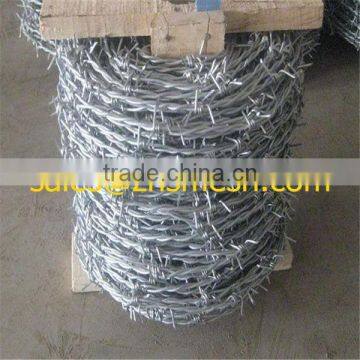 china manufacturer 12X14 electric galvanized / hot dipped barbed wire for military fender wall or prison protection wall