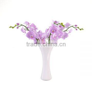 Sleek realistic artificial flower orchid in vase