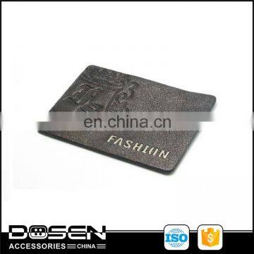 Wholesale high quality PU leather label covered your own brand clothing for cowboy leather label patches .