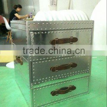 Wooden chest of drawers covered with aluminium