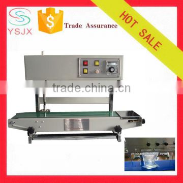 Vertical continuous plastic stand up pouch sealing machine