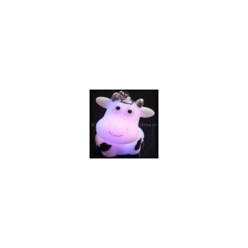 Customized design cow shaped PVC material Color change LED Flashing Keychain for gifts
