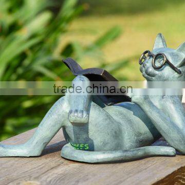 Bronze entertaining cat reading book statue