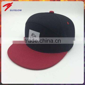 wholesale custom design your own logo 7 panel black snapback hat with woven label