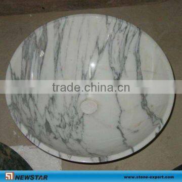 white marble wash basin