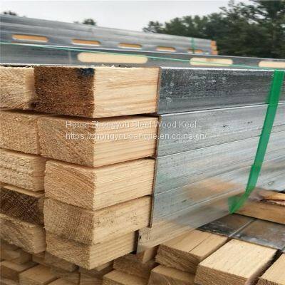 Steel clad wood, steel and wood keel for building construction