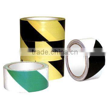 reflective black and yellow caution tape;barrier tape