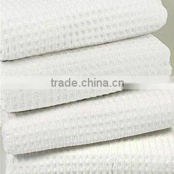 Woven manufacturer of white terry hotel towel in waffle design