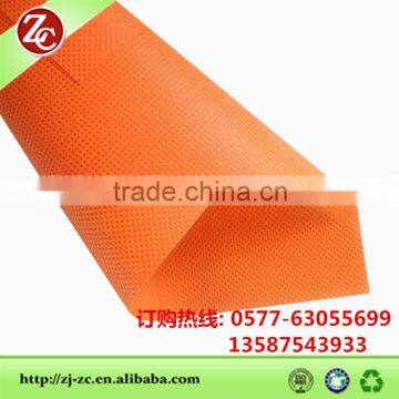 orange colored nonwoven Fabric pp spunbonded fabric in rolls