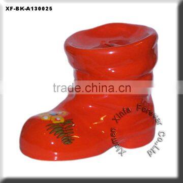 red ceramic boot money box