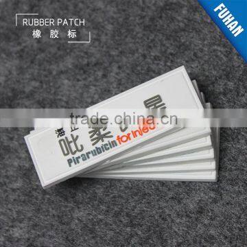 Embossed Custom White Background PVC Rubber Patch Logo photo-2