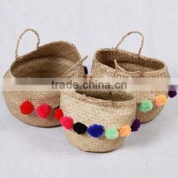 High quality best selling eco-friendly Natural seagrass baskets with colored pompoms from Vietnam