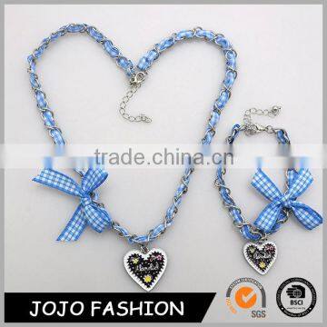 Wholesale blue fabric stainless steel chains bowknot design heart pendant necklace set for Oktoberfest                        
                                                                                Supplier's Choice