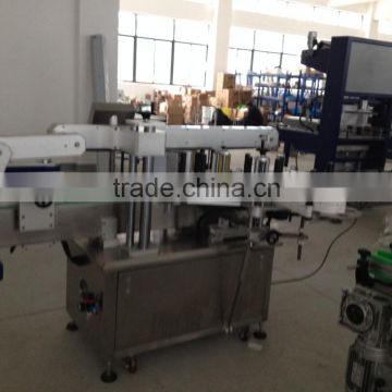 Adhesive two sides labeling machine