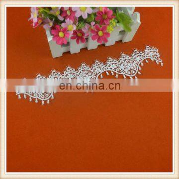 Fancy wholesale natural white cotton crochet lace trim with small tassel rope in scalloped flower design