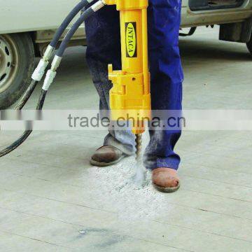 Handheld rock drills