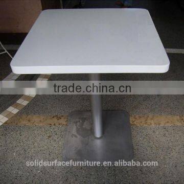 white modern tables and chairs , man made stone table