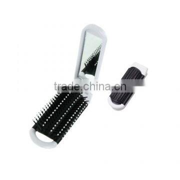 Foldable cosmetic mirror with hair brush