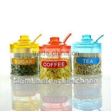 glass spice box with plastic cap and spoon