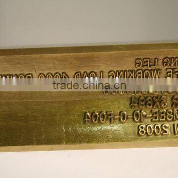 6 lines of text of engraved on brass die to be used in hot stamping part