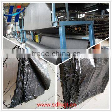 Woven geotextile for road construction