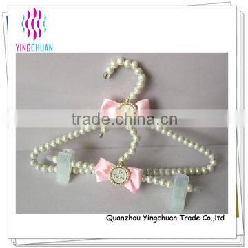 White pearl child pants hanger