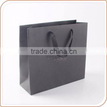 black paper bag for shopping with ribbon handle