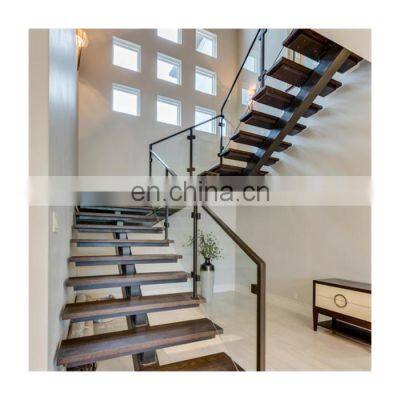 Solid wood treads steel single beam stairs with glass railings design