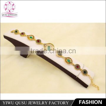 2015 Yiwu new products antique gold plated bracelet with rhinestone and emerald water drop imitation jade