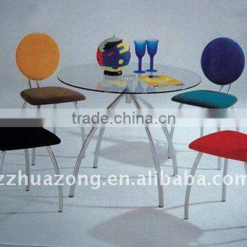 Multicolored round glass dining table and chair