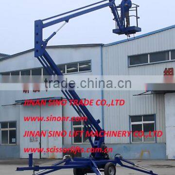 Trailer mounted articulating lift table